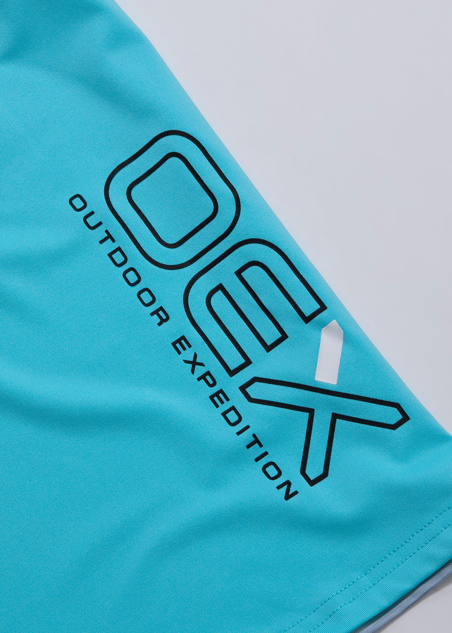 OEX Heuco T-Shirt Infant-Aqua-Side Detail