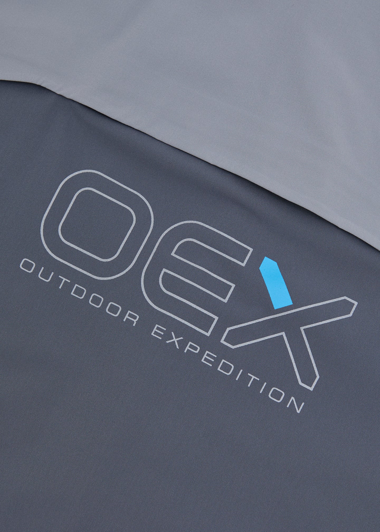 OEX Fell Tracksuit Junior-Charcoal-Logo pocket detail